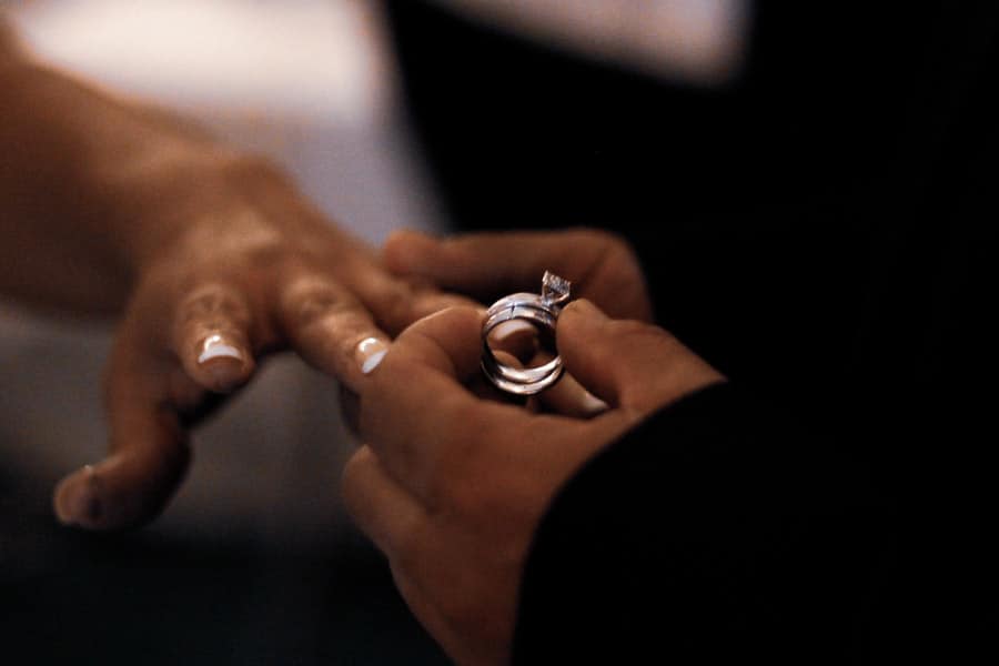 a guy put a ring on the womans finger