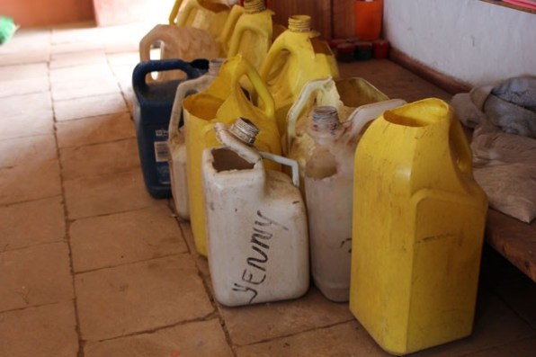 Each child brings water (a heavy lift up and down hills!)  To boil for drinking and supply flushing water for their new indoor toilet.